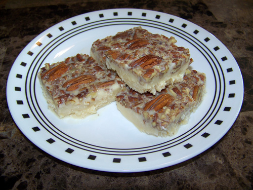 Dulce jamoncillo with pecans on a plate.