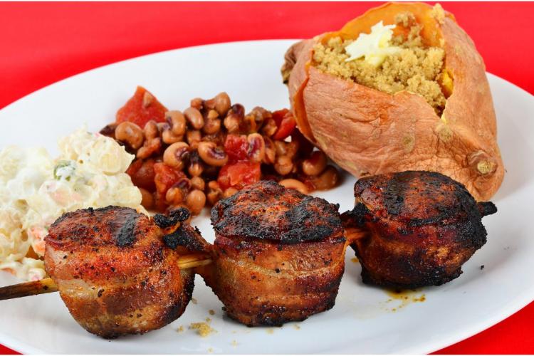 Grilled pork, wrapped in bacon, black eyed peas and baked sweet potato.