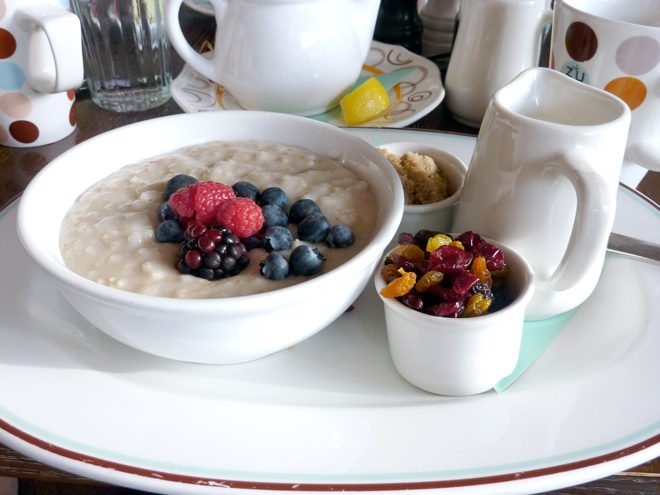 A bowl with oatmeal and fruit