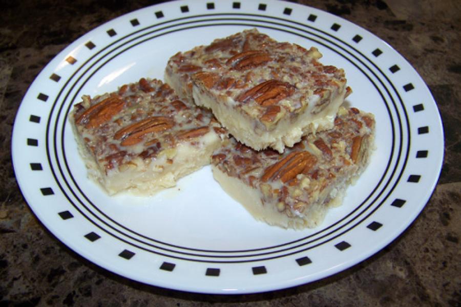 Dulce jamoncillo with pecans on a plate.
