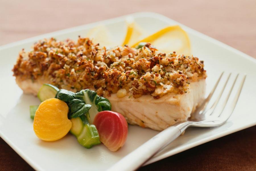 A palte with butter breadcrumbs crusted baked haddock.